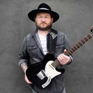 Josh Smith performing on guitar